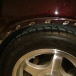Before and after photographs of a damaged Chevy Impala that was repaired by Elite Paint & Body Shop in West Palm Beach, Florida.